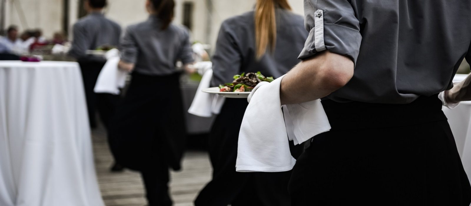 Waiter,Carrying,Plates,With,Meat,Dish,On,Some,Festive,Event